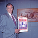Frank Deford holds up a proof of the final cover.
